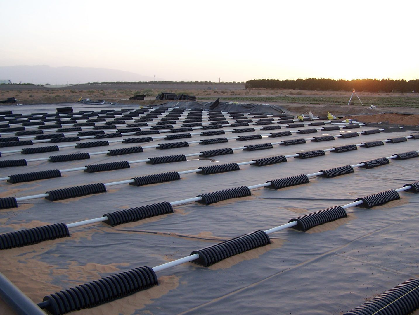 EPIC chamber array laid on the liner at sunset, mountains behind