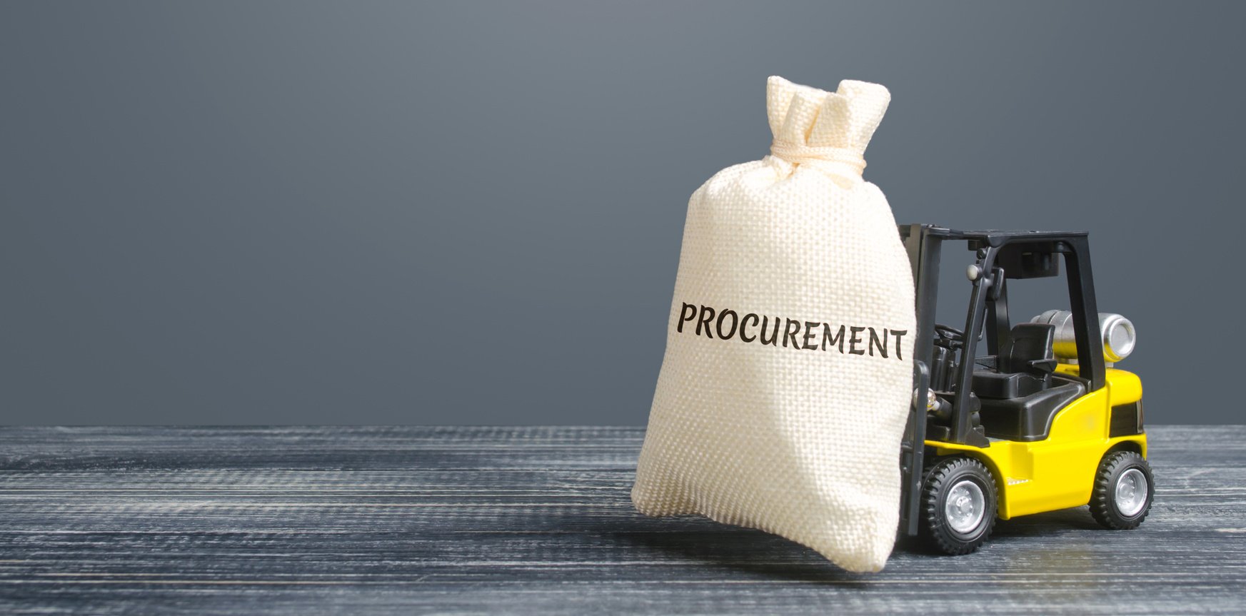 Money bag with the word Procurement and yellow forklift. Logistics, warehousing, transportation of goods, inspection and storage. Procurement management industry concept. Profit, income